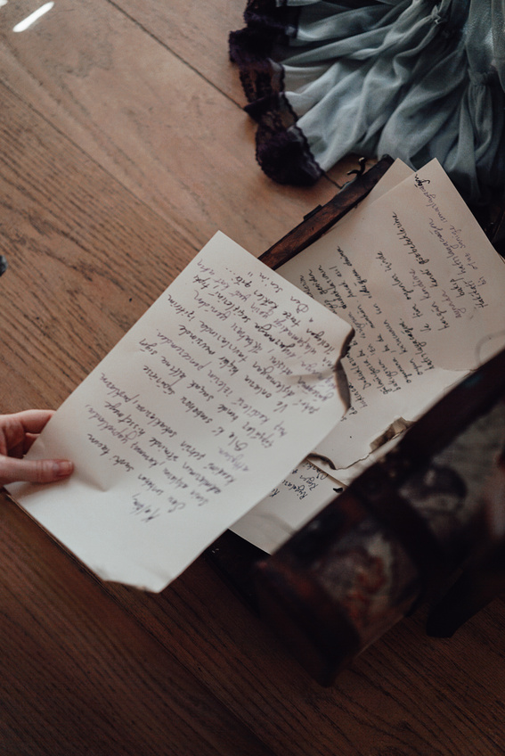 Crop writer showing paper with text above old box